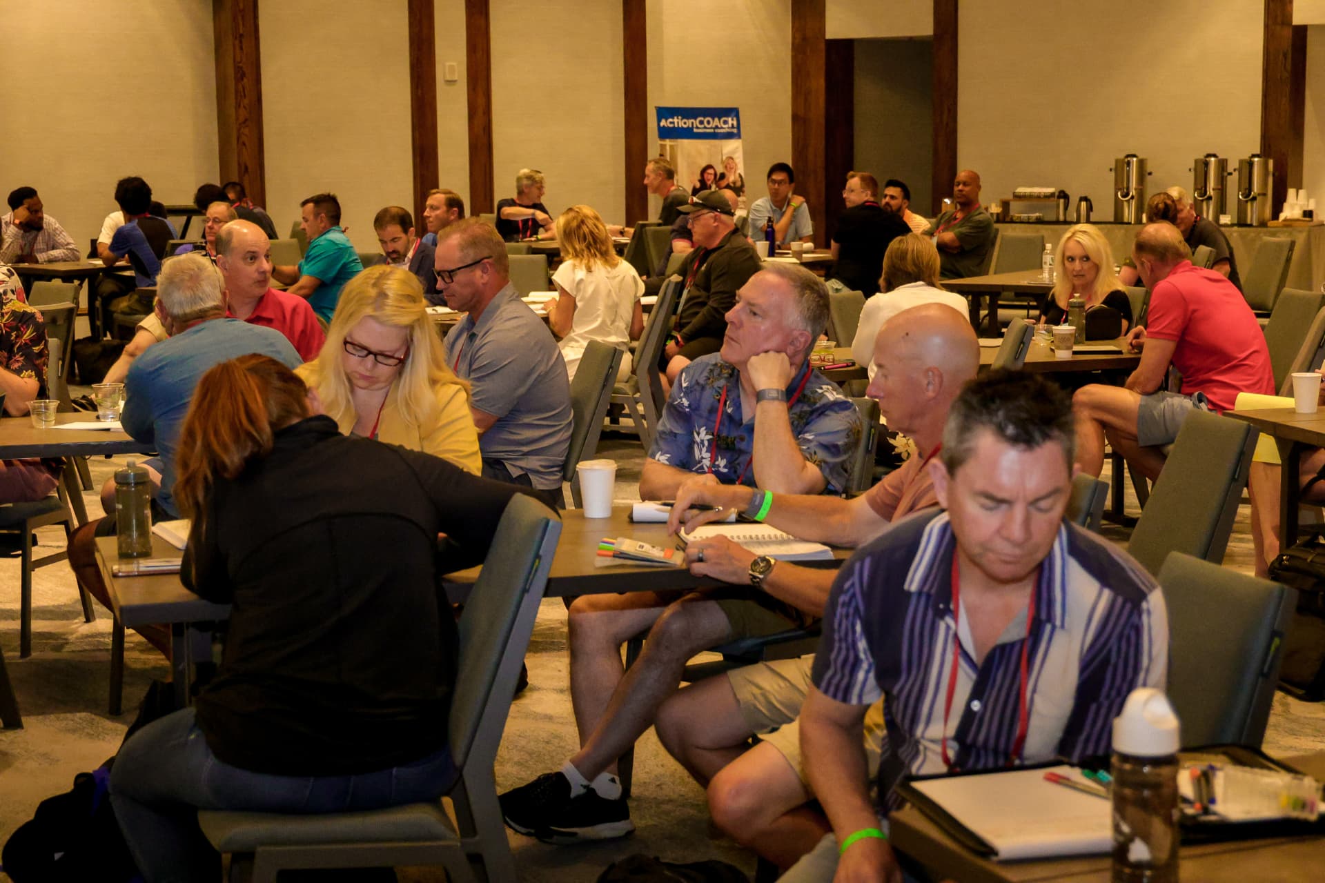 A full room of business owners working through an on-site strategy session