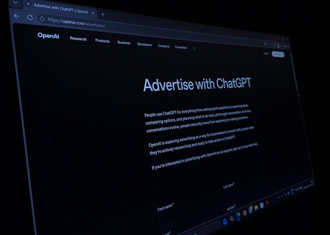 OpenAI advertise with ChatGPT page shown on a screen